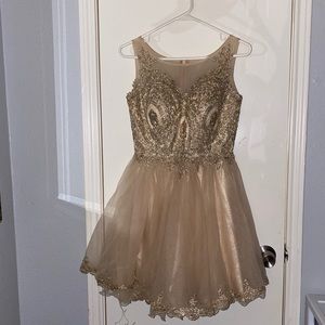 short gold dress with diamonds in it